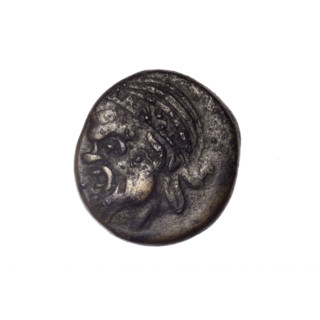 Bronze coin from Pantikapaion depicting the Dioscuri caps (iconographic) and a Satyr's head