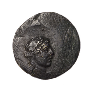 Bronze coin, Pantikapaion. Obverse: head of Apollo in a laurel wreath facing right. Reverse: