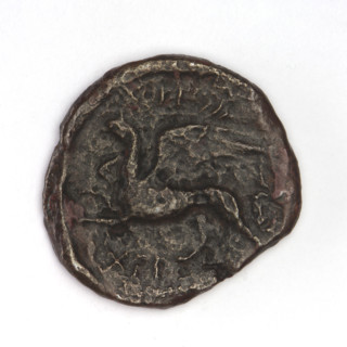 Bronze coin, Chersonesos, 320–310 BC. Obverse: Artemis (Deva) kneeling on right knee facing right,