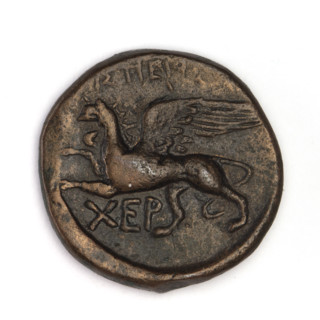Bronze coin, Chersonesos; obverse: Artemis (mythology) kneeling on right knee to the right, bow in