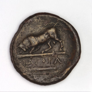 Bronze coin, Chersonesos, 300–290 BC. Obverse: Artemis to the left thrusting a spear into a