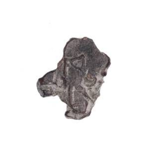 Fragment of a double-sided Drohiczyn seal. On one side, a fragment of a cross with one arm ending