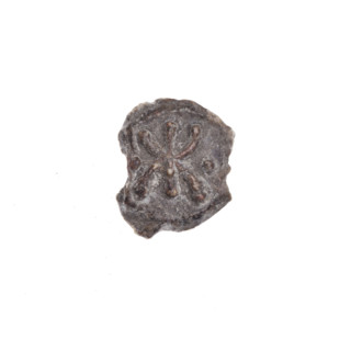 A fragment of a double-sided Drohiczyn seal. On one side, a bident with a crossed-out right arm. On