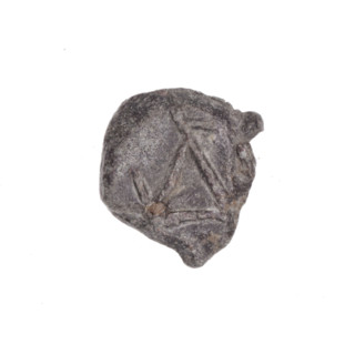 Fragment of a double-sided Drohiczyn seal. On one side a two-pronged seal with a distinct large