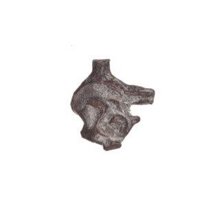 Fragment of a double-sided Drohiczyn seal. On one side, probably a two-pronged shape is visible; on