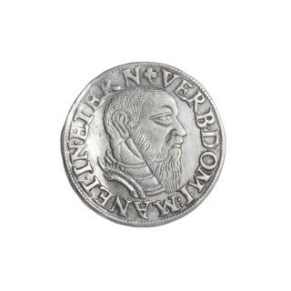 Male bust in armour turned right, with a beard and sideburns; rim with a pearl border and