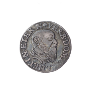 Male bust in armour turned right, with a beard and sideburns; rim with pearl border and inscription