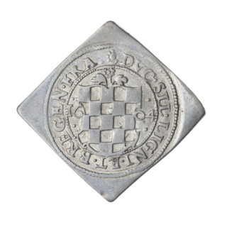 3 kreuzer coin, 1604. Obverse: eagle under a ducal mitre dividing the rim; on his chest within a