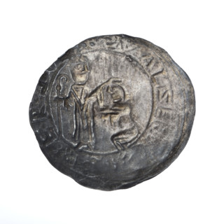 Bracteate, 1135–1138. In a pearl border, on the left, facing right, a kneeling prince (Boleslaw III