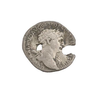 Denarius depicting bust of Trajan facing right, wearing a laurel wreath and robe; rim inscription:
