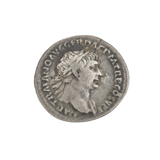 Denarius of Trajan (53–117; Roman Emperor 98–117). Obverse: bust of Trajan facing right, wearing a