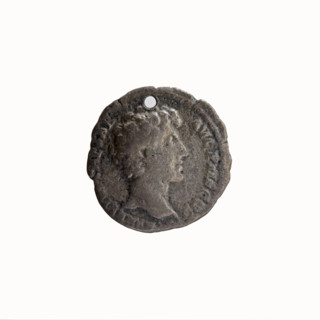 Denarius (with a hole). Obverse: Head of Antoninus Pius in a laurel wreath facing right,