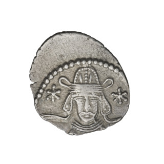 Drachma of Vardanes II (55–58). Obverse: head of Vardanes II in tiara, frontal, with two stars at