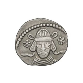 Drachma of Vardanes II (55–58 CE). Obverse: frontal head of Vardanes II with two stars at the