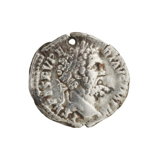 Denarius (with a hole). Obverse: Head of Septimius Severus in a laurel wreath facing right,