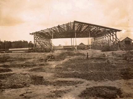Construction of a shed, photograph, Framework of a shed under construction. Part of the group of