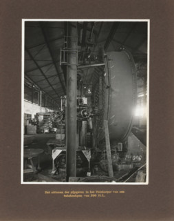 Drilling out pipe holes in the heating element of a 200 HL tubular cooking pot, album page,
