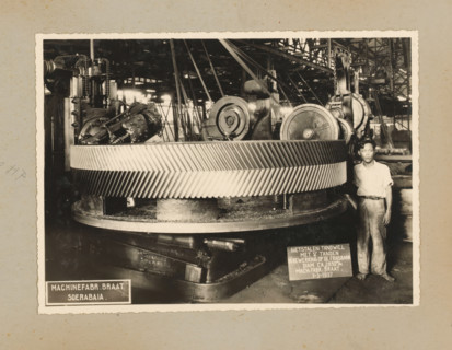 Gear, album page, photograph, Album page with a photo of a cast steel gear being worked on the