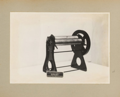 Roller press, album page, photograph, Album page with a photo of a type of roller press. Part of a