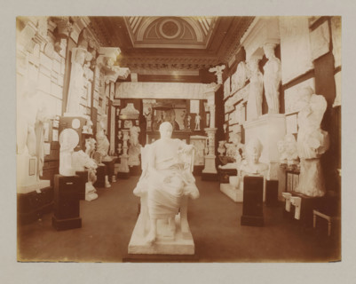 View of a hall with plaster sculptures, album page, photograph, This album page is part of a cover