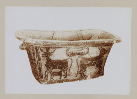 Red earthenware bathtub from the Palace of Knossos, photograph, Bathtub decorated with three