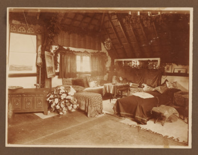 Girl lying on divan, bed in interior, ca. 1916, album page, photograph, ca. 1916. Interior with