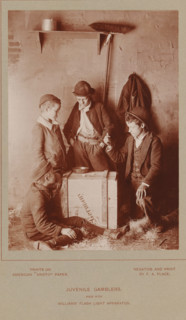 Juvenile Gamblers, Four unknown boys playing dice, photograph, page, inscription: 'made with,