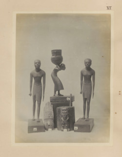 Five Egyptian objects, including two sculptures of boys and a wooden kohl pot with the image of