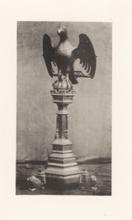 Sculpture of an eagle on a pedestal from the Basilica of Saint Martin in Halle, displayed at an