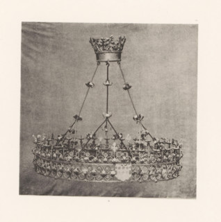 Wrought-iron chandelier from St. Peter's Church in Bastogne, displayed at an exhibition on