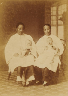 Portrait of two unknown Chinese nannies with babies on their laps, Chinese Amahs, photograph, page,