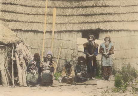 Ainues, the Native of Hokkaido, Japan, Portrait of unknown people of the Aino in front of a house