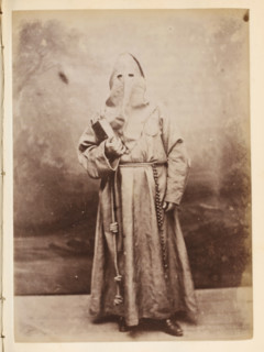 Portrait of someone in a monk's habit and with a hood over their head, photograph, page, Italy, c.