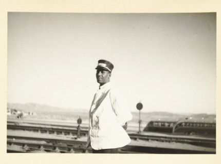 Portrait of an American man, probably working on a train, Unknown location in the United States: