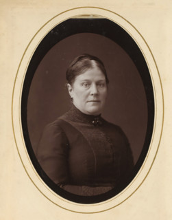 Portrait of a woman, album page, photograph, cabinet photograph, This photo is part of an album.,