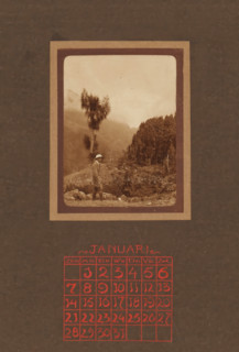 Bound calendar and three loose calendar pages from 1923 with photos of a traveling couple and