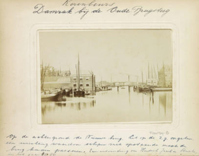 The Damrak. Amsterdam. View of the canal called Damrak., Damrak seen towards the Oudebrug and the