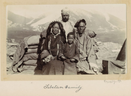 Army intendent with three members of a Tibetan family, Tibet, photograph, Part of Photo album with