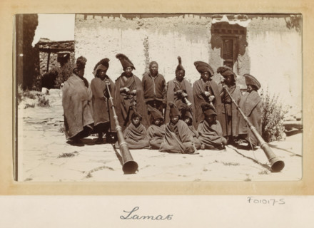 Group of Tibetan lamas with wind instruments (dunchen), Tibet, photograph, Part of Photo album with