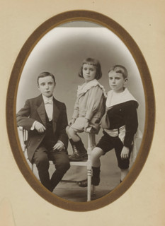 Group portrait of two boys and a young girl, album page, photograph, cabinet photograph, This photo