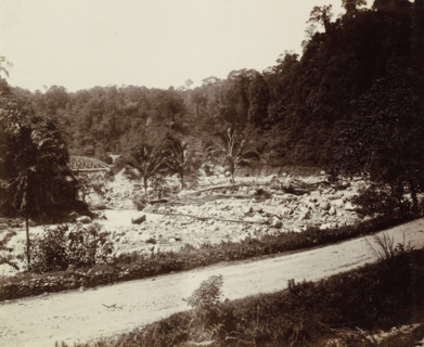 Dried-up riverbed with railway bridge over a brook in the Dutch East Indies, album page,