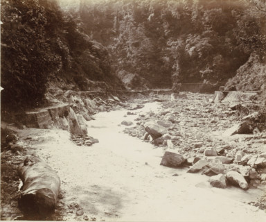 Stream bed with a road in the Dutch East Indies, album page, photograph, Part of Album with photos