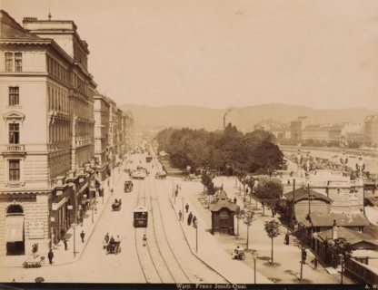 View of the Franz Josefs-Quai. in Vienna with shops, buildings, trams and carts, Wien. Franz