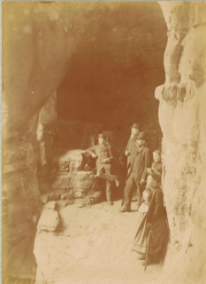 Tourists at the entrance of the Kohlscheuer cave near Echternach, Luxembourg, photograph,