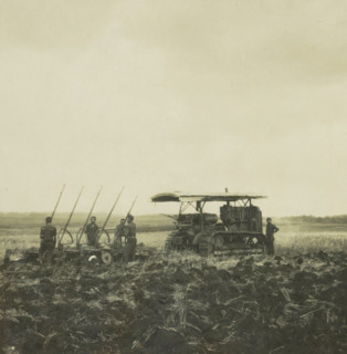 Ploughing machine with farm laborers, possibly on Borneo, Indonesia, stereograph, 1900 - 1940,