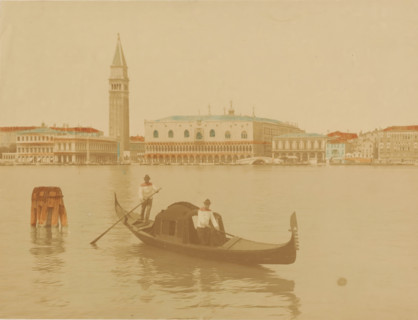 View of the Doge's Palace and the Campanile and in the foreground a gondola in Venice, Italy,