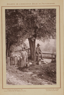 Un coin du Condroz (original title), Boy and a woman by a fence under a tree, Condroz, page,