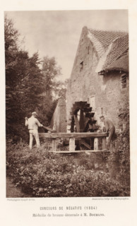 Two men adjust the water level at a watermill, in Eijsden, page, photomechanical print,