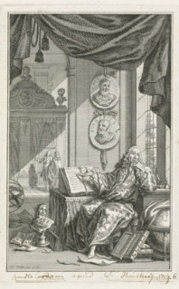 Scholar in study, print, A scholar sits behind a desk in a study and points to an open book. Above