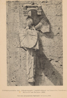 Sculpture of an angel with a sundial on the facade of Chartres Cathedral, page, photomechanical